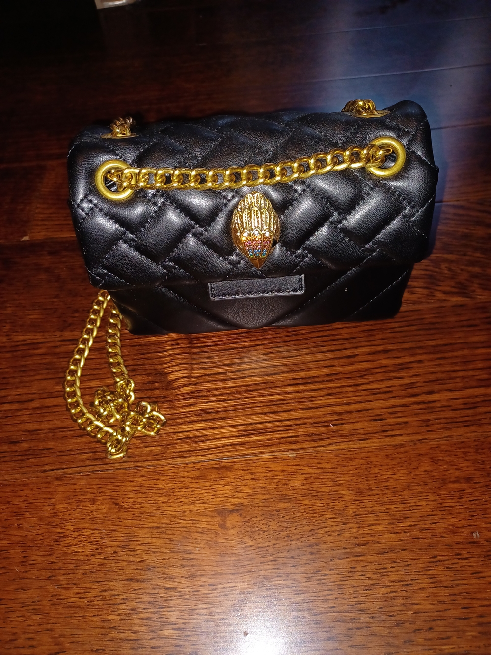 Black Quilted Shoulder Bag with Gold Chain and Jewel Clasp